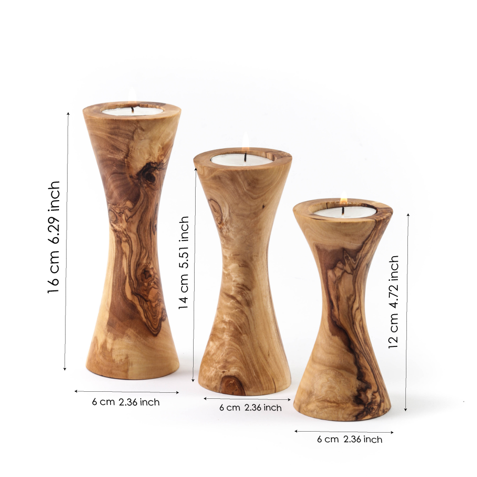 Set of three handcrafted olive wood candle holders in various heights for elegant home décor