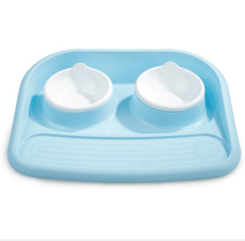 Dual-purpose pet feeding station in light blue with two removable bowls for easy cleaning