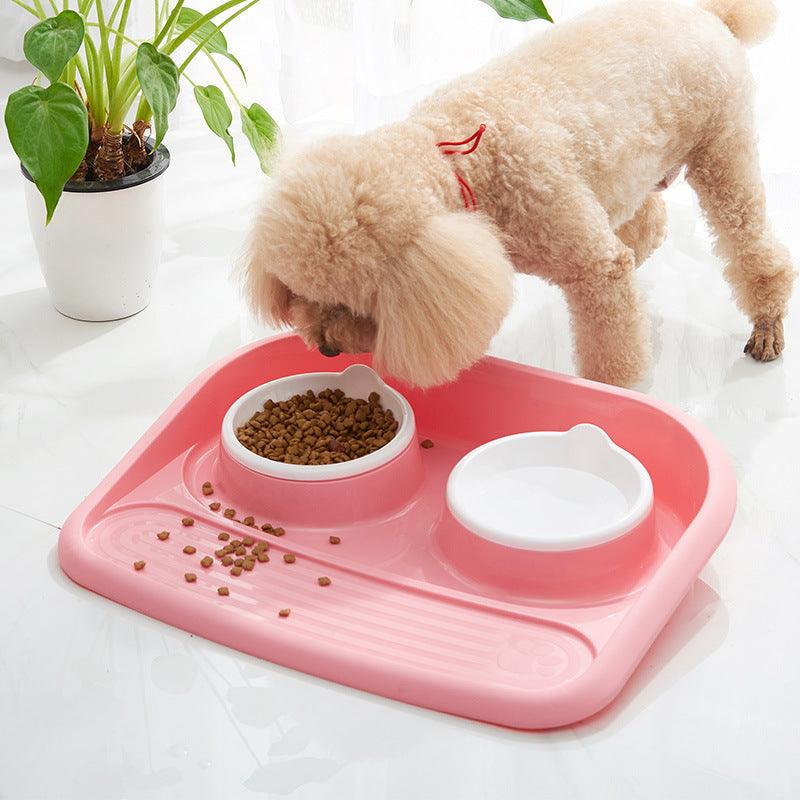Dual-purpose pet feeding station with two bowls for dogs, featuring a non-slip design in pink