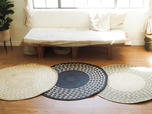 Set of three eco-friendly round mats in various designs for stylish home decor